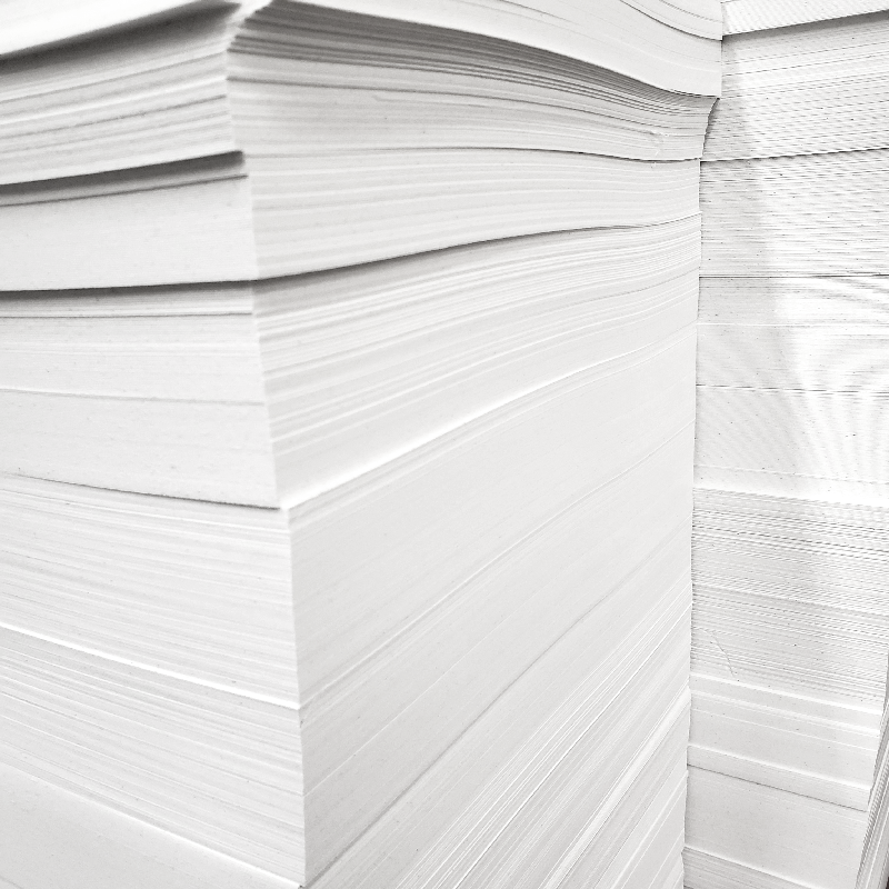 Premium Photo  Stack of white paper for printer on gray background