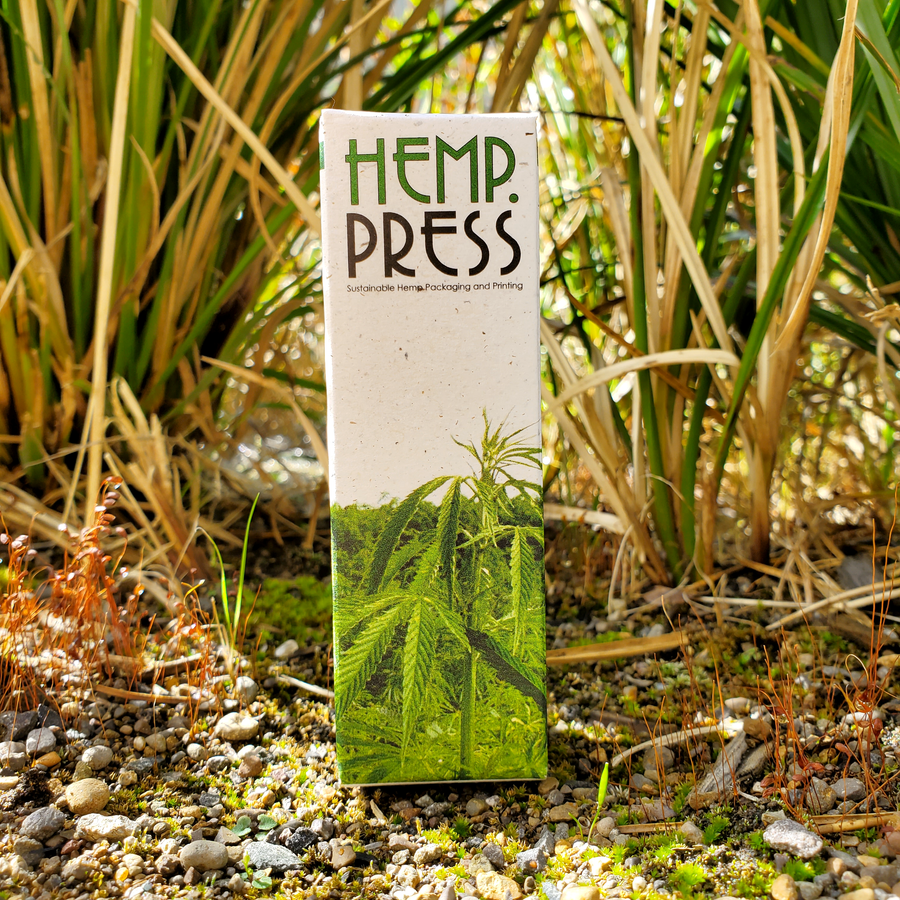 Sample hemp paper packaging photographed outdoors.